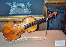 A Stradivarius violin, some of which are regularly ceremoniously played so they maintain their cultural significance Stradivarius violin, Palacio Real, Madrid.jpg