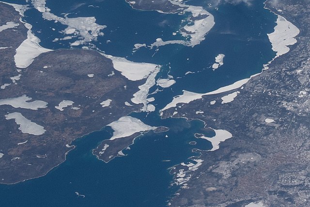 Taken on April 10, 2022, during Expedition 67 of the International Space Station; north is oriented to the right. Mackinac County's border with Emmet 