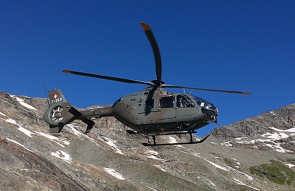 Swiss Army Helicopter, transporting goods (food and wood) and workers to high alpine huts.