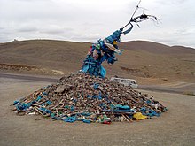 Ceremonial cairn of rocks, an ovoo, from Mongolia TallOvoo.JPG