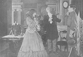 The Defender of the Name (1912), film still with Marion Leonard and Graham Velsey in uniform.jpg