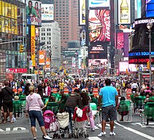 According to Travel + Leisure magazine's October 2011 survey, Times Square in Midtown Manhattan, iconified as the Crossroads of the World,[252][253][254][255][256] is the world's most visited tourist attraction, bringing in over 39 million visitors annually.[257]