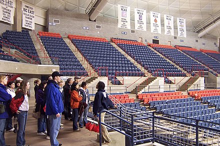 A student leading a 2005 campus tour at UConn shows off the school's women's basketball championship banners in the university's arena