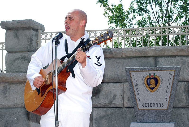 File:US Navy 080825-N-7975R-001 Mass Communication Specialist 3rd Class and American Idol finalist Phil Stacey performs at the Veteran Administration's Western New York Medical Center.jpg