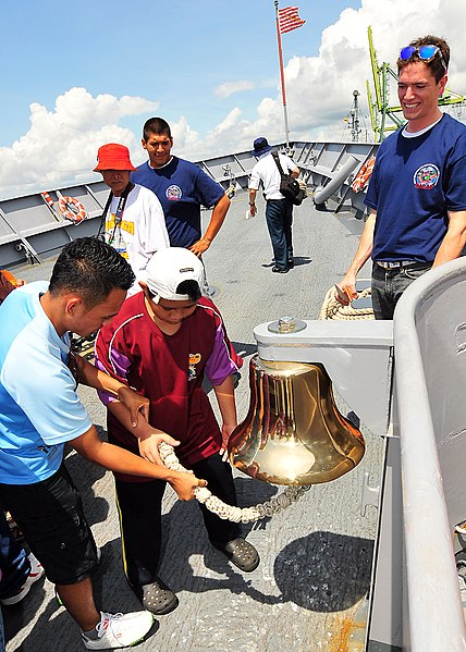 File:US Navy 100508-N-7643B-030 A group of children from the Society for the Management of Autism Related Issues in Training, Education and Resources (SMARTER) school of Brunei rings the forecastle bell during a tour of the guided-m.jpg