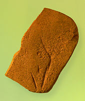 Steinzeitliche Frauendarstellung, die sogenannte „Venus von Bierden“, auf einem Sandsteingerät