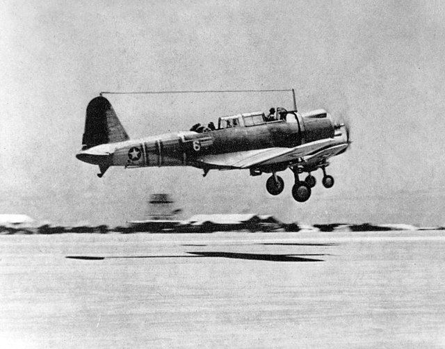 Two Vought SB2U-3 Vindicators of VMSB-241 take off from Midway Atoll. Plane No. 6 in the foreground (BuNo 2045) was flown on June 4, 1942 by 2nd Lt Ja