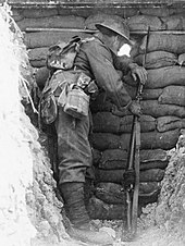 A sentry from the Worcestershire Regiment manning a position in France during 1916 Worcester Regiment sentry in trench Ovillers 1916 IWM Q 4100.jpg