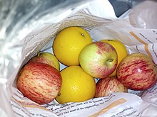 Apple, lemon in paper bags