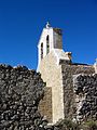 Vista fronto-lateral izquierda de la iglesia de la Trinidad en Moya (Cuenca), con detalle de la espadaña, tras su restauración.