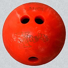 A house ball with a conventional grip: finger holes are relatively close to the thumb hole compared to balls with fingertip grip. 20190118A Plastic house bowling ball conventional grip.jpg