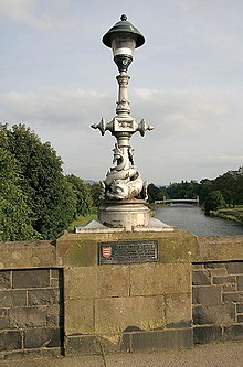 The dolphin street lamps date from the widening between 1897 and 1900 A dolphin lamp standard on Tweed Bridge, Peebles - geograph.org.uk - 1000747.jpg