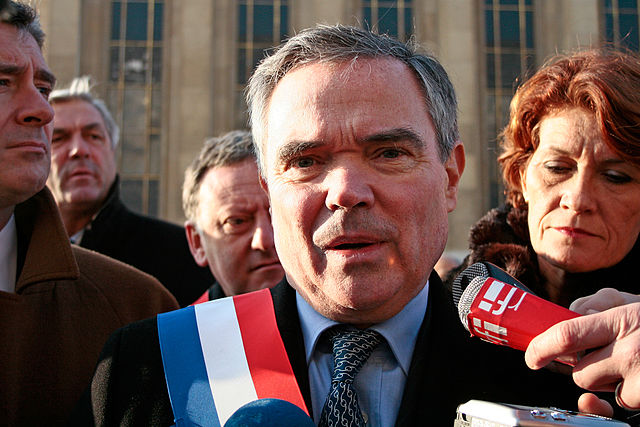 Deputies wear tricolor sashes on official occasions outside the Assembly or on public marches, like other elected officials in France; former Presiden