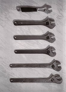 From the bottom:
The first BAHCO-improvement adjustable wrench from 1892 (Enkoping Mekaniska Verkstad)
Adjustable wrench from 1910 with an improved handle (BAHCO)
Adjustable wrench from 1915 with a slightly rounder handle (BAHCO)
Adjustable wrench from 1954 with improved handle and new jaw angle of 15 degrees (BAHCO)
Adjustable wrench from 1984 and the first with ERGO handle (BAHCO)
Today's version of the adjustable wrench from 1992 with ERGO (BAHCO) Adjustablewrenches.jpg
