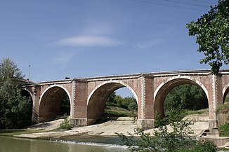 The Arbia river with the Ponte d'Arbia bridge in Ponte d'Arbia (district of Monteroni d'Arbia)