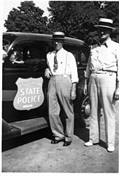Bloomfield law enforcement officers (Deputy Sheriff Lem Clark, center) with the Indiana State Police circa 1940 Bloomfield Indiana Police with Indiana State Police circa 1948.jpg