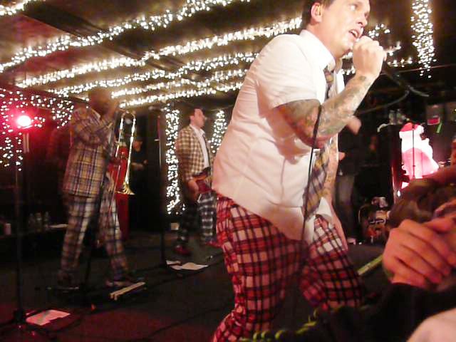 The Bosstones in 2008, wearing their trademark plaid clothes. Front: Dicky Barrett, Back, from left: Chris Rhodes, Lawrence Katz