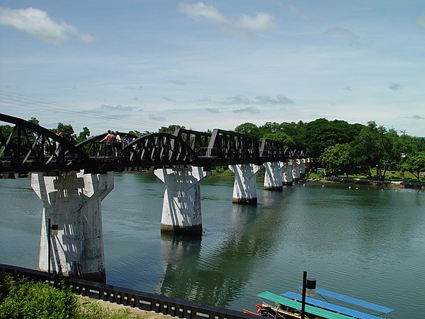 The bridge over the Kwai River in June 2004. The round truss spans are the originals; the angular replacements were supplied by the Japanese as war reparations.