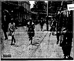 B&W photo of people running on the street