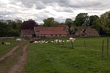 The hall and outbuildings. The hall is at the rear right, and the courthouse is to its left Colburn Hall (geograph 4473295).jpg