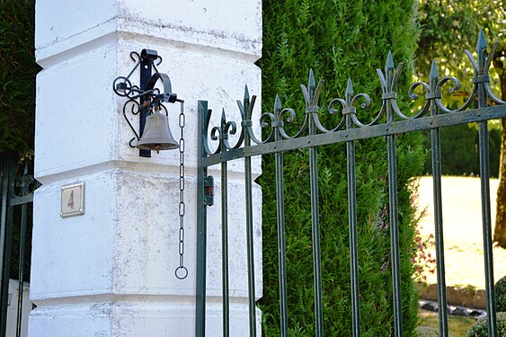 Iron portal and doorbell in Marigny, France