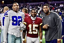 Armstrong (left) with former Kansas teammates Steven Sims (middle) and Daniel Wise (right), 2019 Dorance Armstrong Steven Sims 2019.jpg