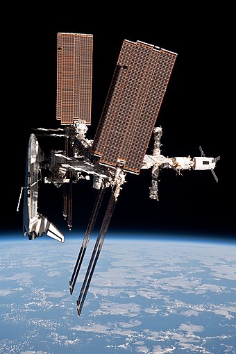 Space Shuttle Endeavour, ATV-2, Soyuz TMA-21, and Progress M-10M docked to the ISS, as seen from the departing Soyuz TMA-20