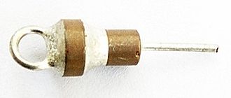 Ceramic feedthrough capacitor with cable lug and a capacitance of 1 nF. Feedtrough cap small.jpg