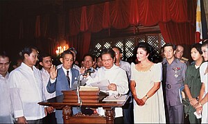 President Ferdinand E. Marcos is sworn by Chief Justice Ramon Aquino in the Ceremonial Hall of Malacanan Palace on February 25, 1986. Ferdinand Marcos 1986 inauguration.jpg
