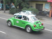 A Volkswagen Beetle taxi in Mexico City. Kafertaxi in Mexiko-Stadt.fcm.jpg