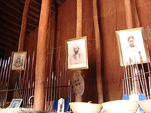 The interior of the Muzibu Azaala Mpanga in 2007, included relics and portraits of the buried kabakas Kampalas Kasubi Tombs (2064308892).jpg