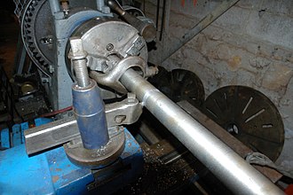 Bent tail lathe dog hooked on chuck jaw. Lathedog.jpg