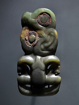 Pounamu (greenstone) hei tiki ornamented with paua (abalone) shell and pigments, 1500-1850. MAP Expo Maori Hei tiki 15 01 2012 1.jpg