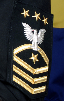 The badge of the Master Chief Petty Officer of the U.S. Navy, worn on a service dress blue uniform's sleeve MCPON Ratebadge.png