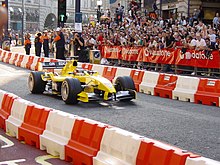 Nigel Mansell demonstrates an EJ14 in the streets of London in the days leading up to the 2004 British Grand Prix. Mansell jordan 2004.jpg