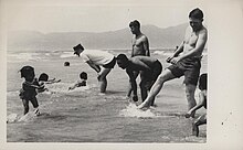 Black and white Marines play with children from an orphanage. Marines Play With Children From Orphanage, 4 May 1968.jpg