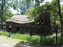 Cabin where Twain wrote "Jumping Frog of Calaveras County", Jackass Hill, Tuolumne County. Click on historical marker and interior view. Mark Twain Cabin Exterior MVC-082X.jpg