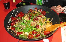 Mongolian Mn-Mye. A mixture of flat noodles, vegetables, meat and seafood. Hundreds of variations - made to order in minutes in many Wuhai restaurants