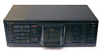 Nakamichi RX-505 cassette deck; this one has an auto reverse feature that rotates the cassette, hence the bump in the middle. Nakamichi RX 505 Front edited.jpg