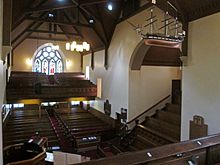 The Old West Kirk features a scale model of a 20-gun frigate above its Sailor's loft: the Laird's Gallery is on the right. Old West Kirk Farmer's Loft.jpg