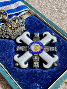 Order of St Marinus - Third Class Commander badge. Order of St Marinus - Third Class Commander badge.png