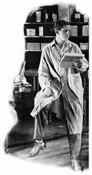 A skeptic scientist rests on his desk, wearing a lab coat and holding a notepad