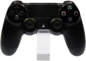 A PlayStation 4 Controller. The PlayStation 4 was released in 2013 and succeeded the PlayStation 3 and Xbox 360, the seventh generation systems that started out the 2010s.