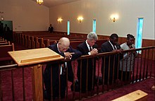 Adams (left) praying with Bill Clinton in 1996 President Bill Clinton Prays with Bishop John Hurst Adams and Pastor Terrence Mackey an Mount Zion A.M.E. Church.jpg