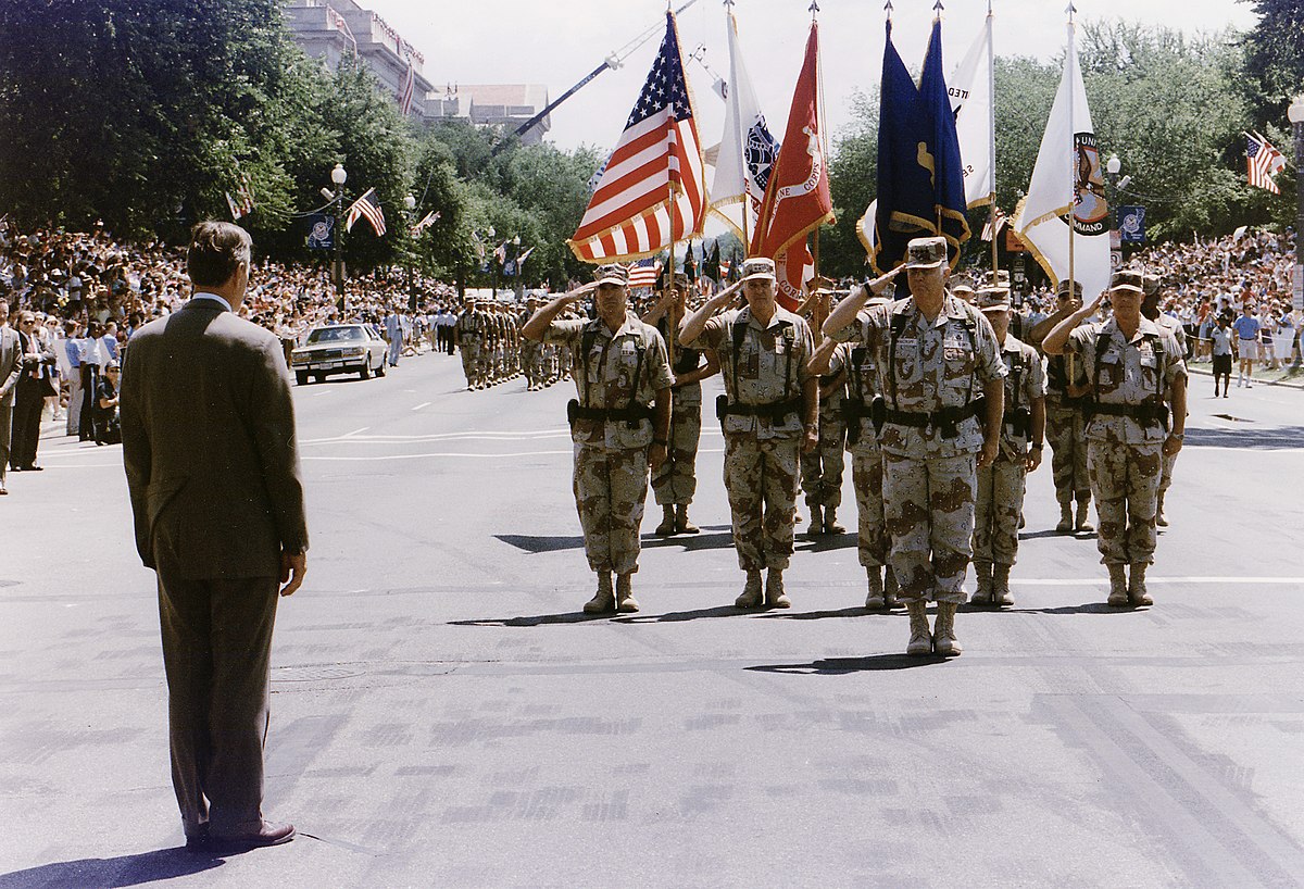 President Bush greets General H. Norman Schwarzkopf who leads the Desert Storm Homecoming Parade in Washington, D.C - NARA - 186434.jpg