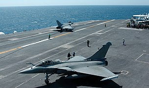 Two French Rafale Jets perform launch and recovery operations from the flight deck of the aircraft carrier USS Harry S. Truman (CVN 75)