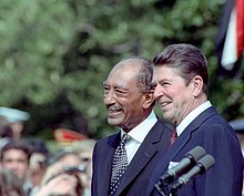 Egyptian President Anwar Sadat with Reagan in a joint press conference at the White House, 1981 Reagan and Sadat 1981.jpg