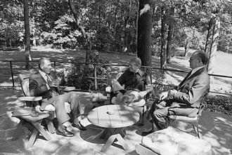 Anwar Sadat, Jimmy Carter and Menachem Begin meet on the Aspen Lodge patio of Camp David on September 6, 1978. Sadat Carter Begin, Camp David 1978.gif