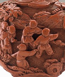 Detail of Chinese carved lacquer snuff bottle with Children at Play, and three types of diaper backgrounds, representing ground, water and sky. 18th century Snuff Bottle (Biyanhu) with Children at Play LACMA M.71.100.10a-b (1 of 2) (cropped).jpg