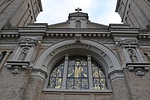 West facade with black and gilt window St. James Cathedral 4 (Seattle, Washington).JPG